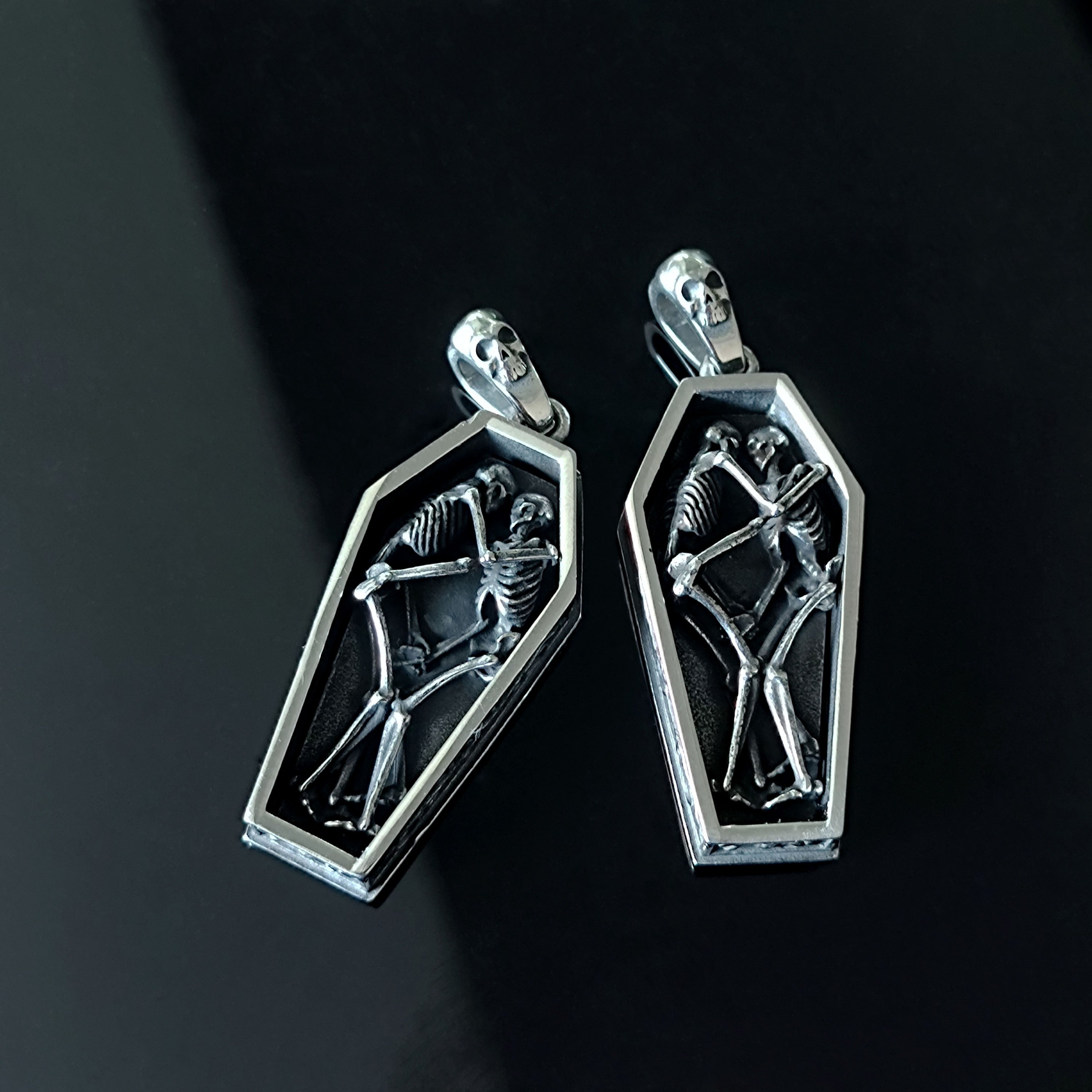 Skeletons Cuddling in a Coffin